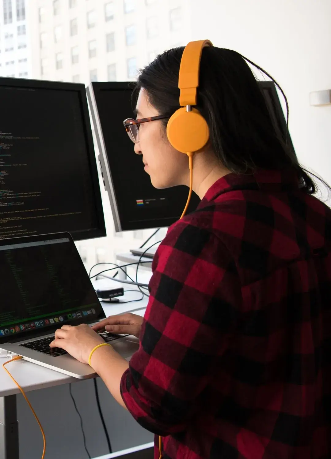A learner working with code on screen